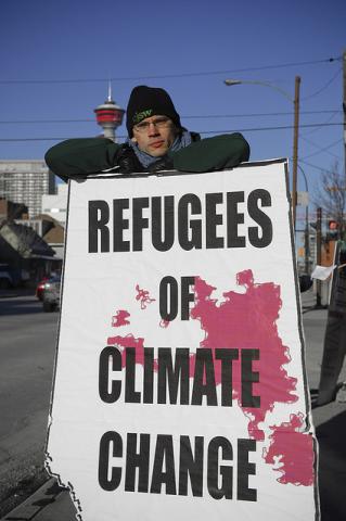 Demonstrant auf dem internationalen Aktionstag gegen den Klimawandel (ItzaFineDay CC BY 2.0)
